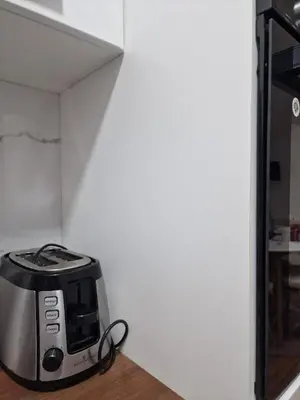 a toaster sitting on a counter in a kitchen at Apartments Gradiska in Bosanska Gradiška