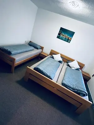 two twin beds in a room withthritisthritisthritisthritisthritisthritisthritisthritisthritis at Apart Cobras Jajce in Jajce