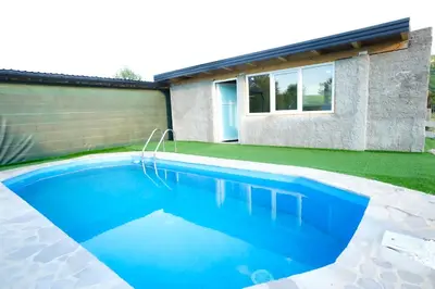 a swimming pool in the backyard of a house at Apartment Lane in Bihać