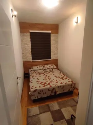 a small bedroom with a bed and a window at La Mia Casa in Bihać