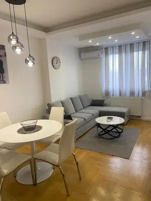 a living room with a couch and a table at Infinity in Banja Luka