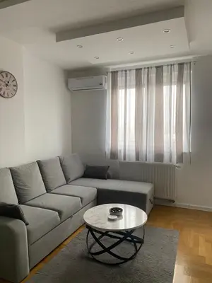 a living room with a couch and a coffee table at Infinity in Banja Luka