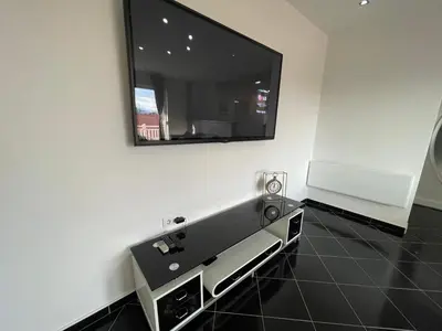 a bathroom with a sink and a mirror on the wall at Apartman MN Teslic in Teslić
