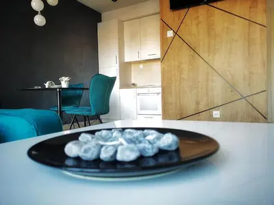 a plate of food on a table in a kitchen at Downtown apartment in Banja Luka