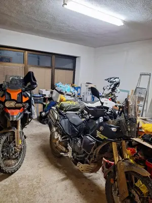 a room with a motorcycle parked in a garage at Apartman Darko in Kupres