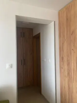 an empty room with a closet and a mirror at Apartman Green in Šišava