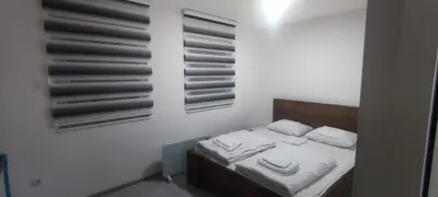 a small bedroom with a bed with white sheets and pillows at Perfect Holidays in Vlasic