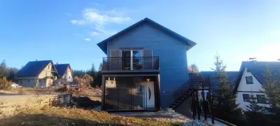 a house with a balcony on the side of it at Perfect Holidays in Vlasic