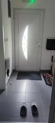 a pair of shoes on the floor in front of a door at Perfect Holidays in Vlasic