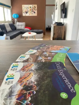 a book on the floor of a living room at Penthouse stan 80m2, terasa 36m2, garaža... centar Banja Luke - gradski park in Banja Luka