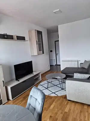a living room with a couch and a tv at Apartman Mia 2 Banja Luka in Banja Luka