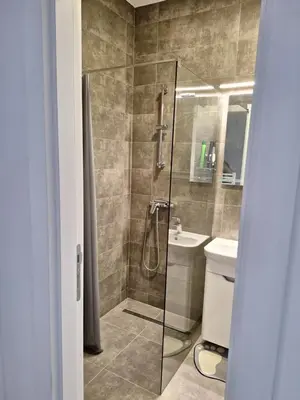 a bathroom with a shower and a sink at Apartman Mia 2 Banja Luka in Banja Luka