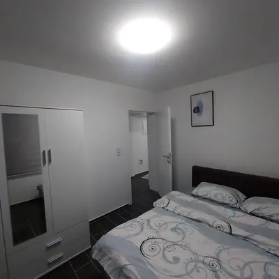 a bedroom with two beds and a mirror at Eurouna relax in Bosanska Krupa