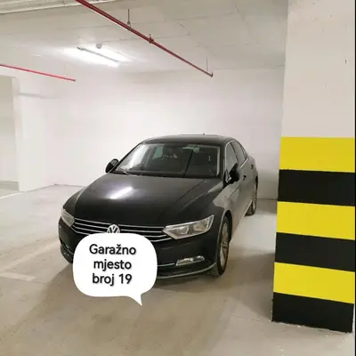 a black car parked in a parking garage at Alex LUX in Banja Luka