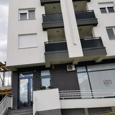 a white building with windows and a balcony at Alex LUX in Banja Luka