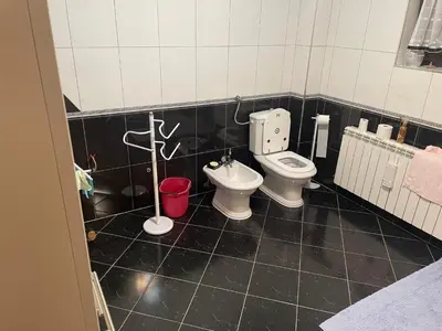 a bathroom with a toilet and a bidet at Villa Janković in Modriča