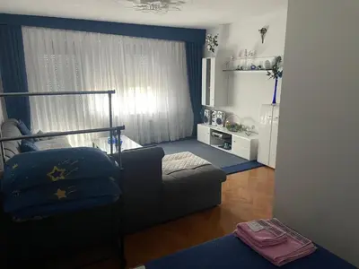 a living room with a couch and a chair at Villa Janković in Modriča