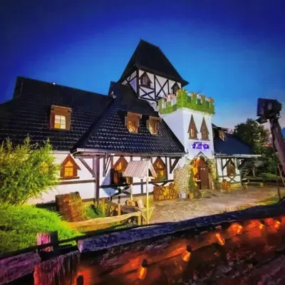 a large white house with a black roof at Kraljevsko selo Kotromanićevo in Doboj