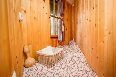 a room with a bed with a basket on it at Kraljevsko selo Kotromanićevo in Doboj