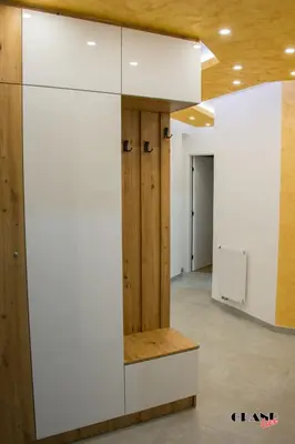 a large white cabinet in a room with wooden walls at GRAND LUX Mihajlo in Doboj