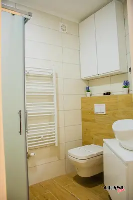 a bathroom with a toilet and a sink at GRAND LUX Mihajlo in Doboj