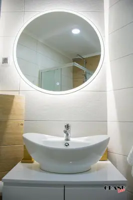 a bathroom with a white sink and a mirror at GRAND LUX Mihajlo in Doboj