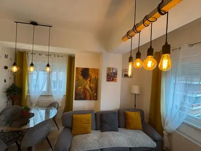 a living room with a couch and a table at Apartman Vera in Banja Luka
