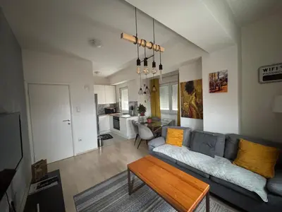a living room with a couch and a table at Apartman Vera in Banja Luka