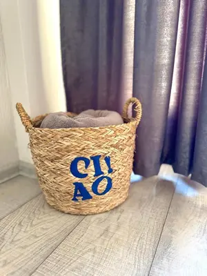 a basket with the number sitting on the floor at Apartmani Lara&Sara in Bihać