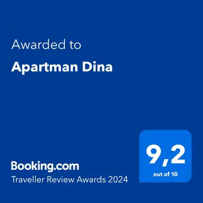 a blue text box with the words awarded to aprilanan dinian at Apartman Dina in Bihać