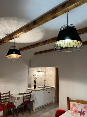 a kitchen with two lights hanging from the ceiling at Apartmani Subotic in Bosanska Gradiška