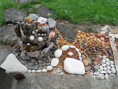 a garden made out of rocks and stones at River house - Riječna idila in Cazin