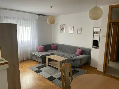 a living room with a couch and a table at Apartman Lola in Banja Luka