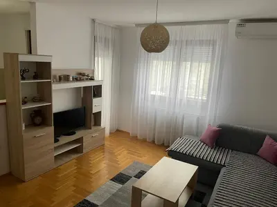 a living room with a couch and a table at Apartman Lola in Banja Luka