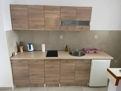 a kitchen with a sink and a counter top at Apartman Lola in Banja Luka