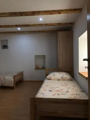 a bedroom with two beds in a room at Kuća za odmor Ravančić in Sopot