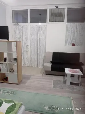 a living room with a couch and a table at Studio apartman Sokak in Bihać