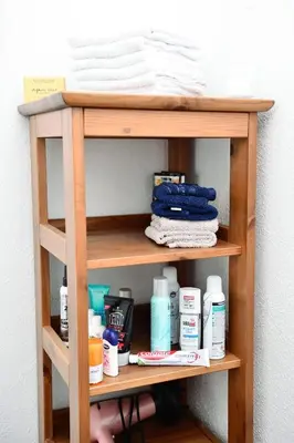 a wooden shelf with products on it at Stela1 in Drvar
