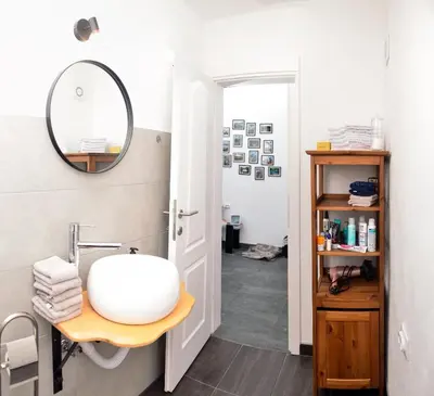 a bathroom with a sink and a mirror at Stela1 in Drvar