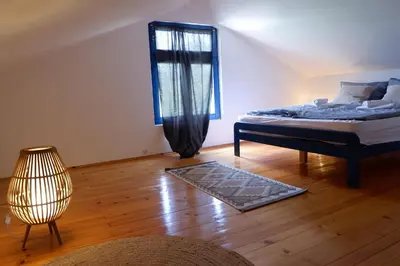 a bedroom with a bed and a window at Bosnian Mountain Retreat in Prijedor