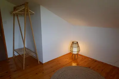 a lamp sitting on a wooden floor in a room at Bosnian Mountain Retreat in Prijedor