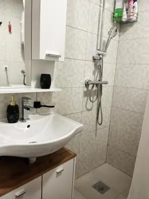 a bathroom with a sink and a shower at S-E-N in Bosanski Novi