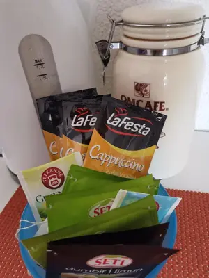 a group of snacks in front of a jar of food at Jelly Apartment in Visoko