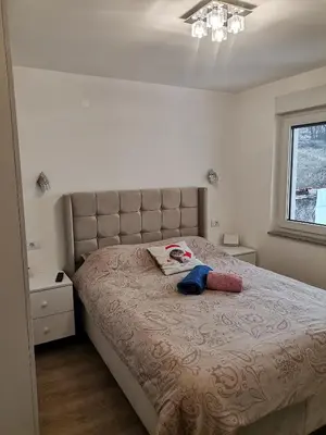 a bedroom with a large bed in a room at City Break Apartment in Banja Luka
