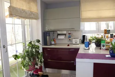 a kitchen with a counter and some plants in it at Holiday Home Uma in Visoko
