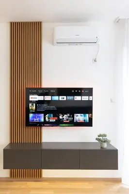 a television on a wall in a living room at Drobac apartment in Banja Luka