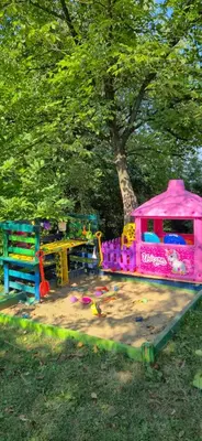 a pink play house sitting in a park at Dream weekend house in Visoko