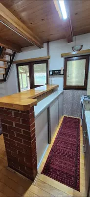 a kitchen with a counter and a red rug at Dream weekend house in Visoko