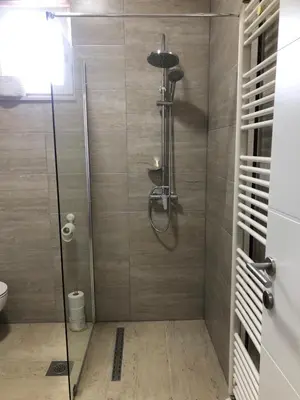 a shower with a glass door in a bathroom at Gracia in Jajce