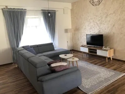 a living room with a couch and a tv at Gracia in Jajce
